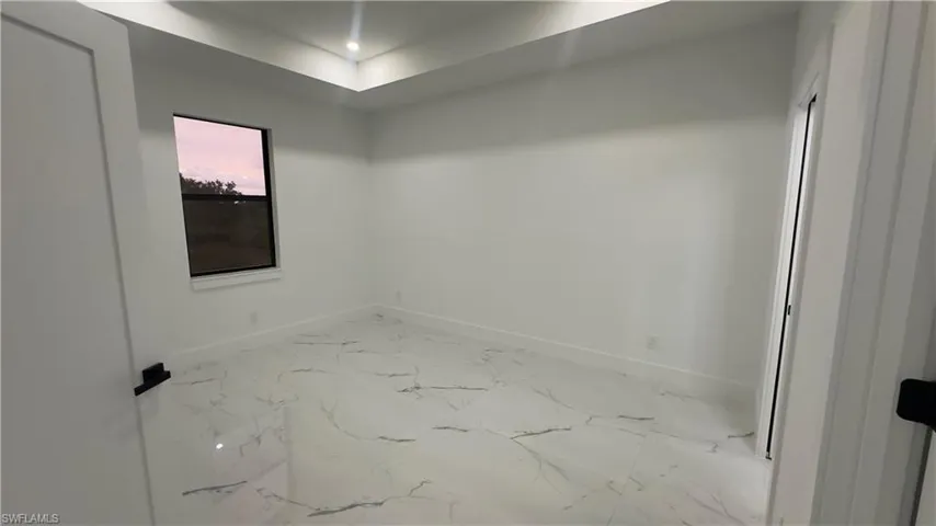 Unfurnished room featuring tile flooring