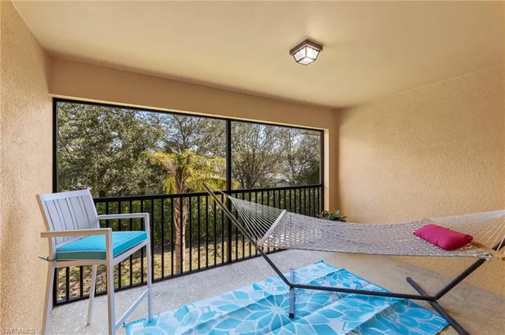 Back patio off the living room. Peaceful spot for relaxing, privacy hedge.