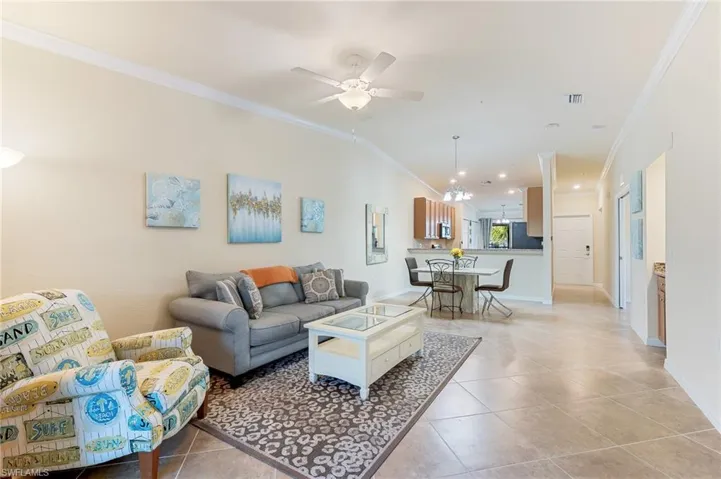 Combined Dining and Living Area, tile flooring vaulted ceiling.