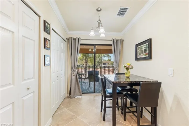 Nook in kitchen with pantry on left, convenient access to screened lanai.