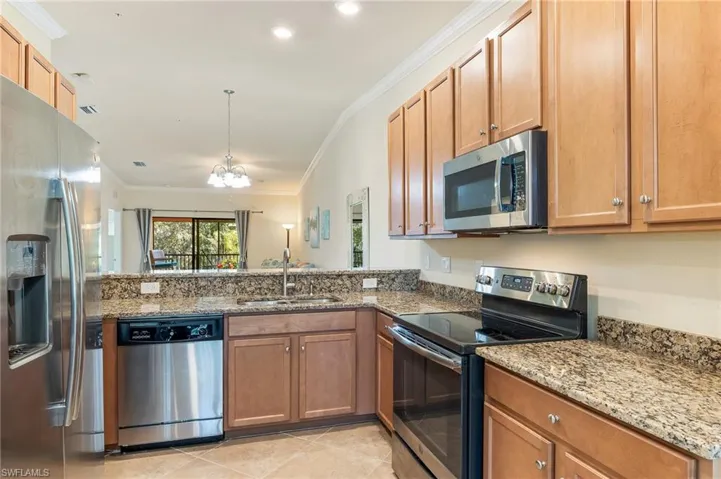 Granite counter-tops, wood cabinets and SS appliances.