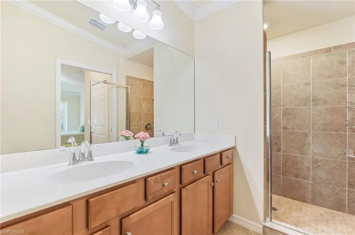 Dual sinks, walk-in shower, water room.