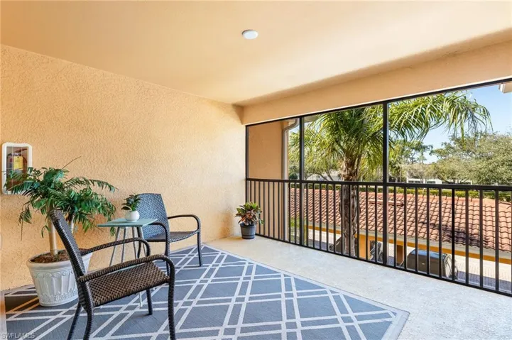 Large patio at top of stairs outside front door entry.