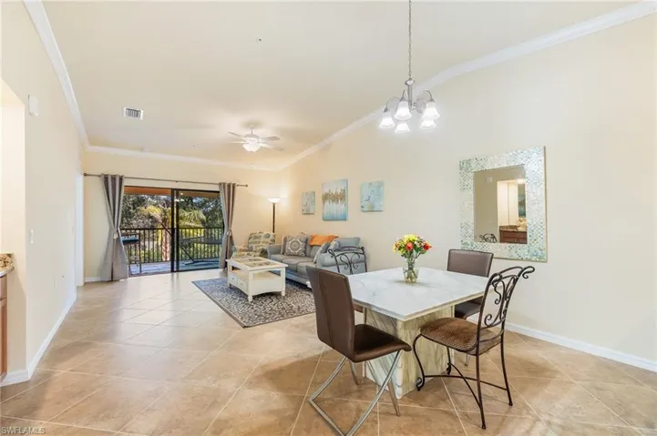 Great room floorplan with tile, vaulted ceilings, crown molding.