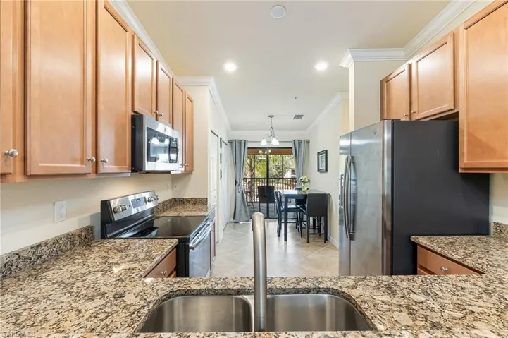 Breakfast Bar looking into kitchen and nook.