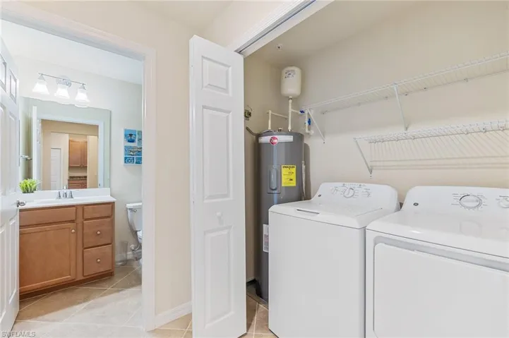 In-home laundry closet with GE Washer & Dryer.