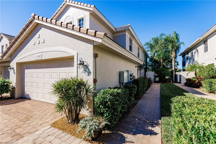 View of side of home featuring a garage
