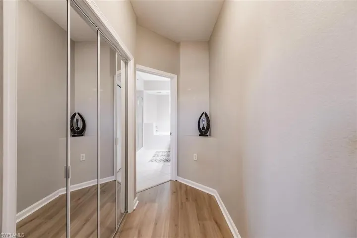 Hallway featuring light hardwood / wood-style flooring