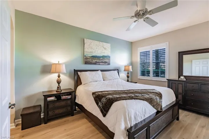 Bedroom featuring ceiling fan and light hardwood / wood-style flooring
