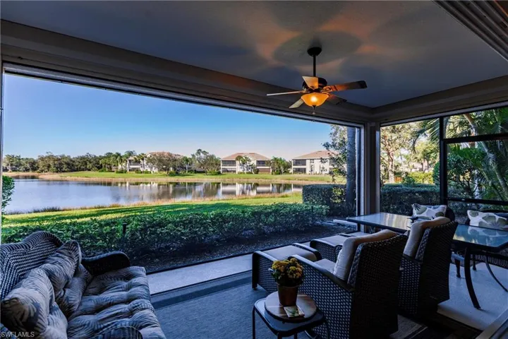 View of patio with outdoor lounge area, a water view, and ceiling fan