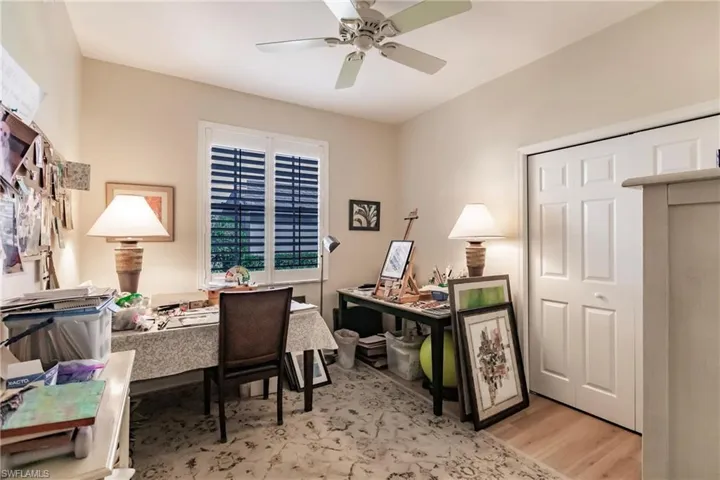 Office space featuring ceiling fan and light wood-type flooring