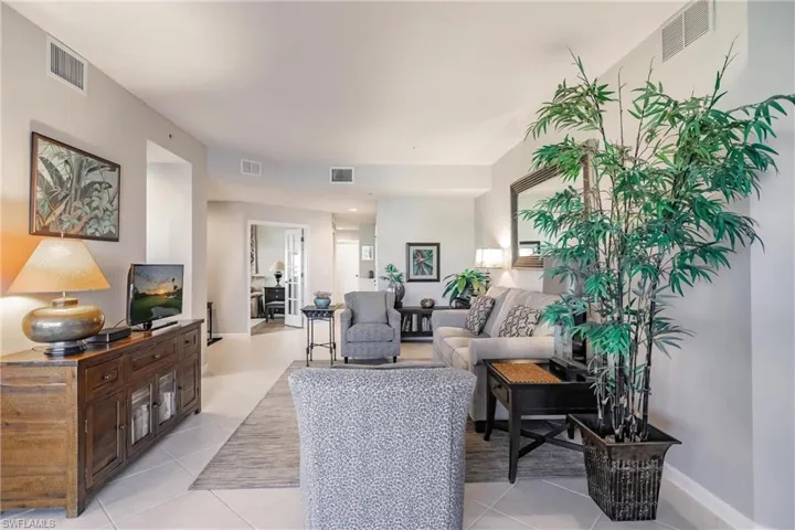 Living room with light tile patterned floors