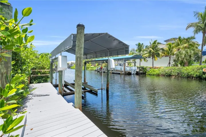 Dock area featuring a water view