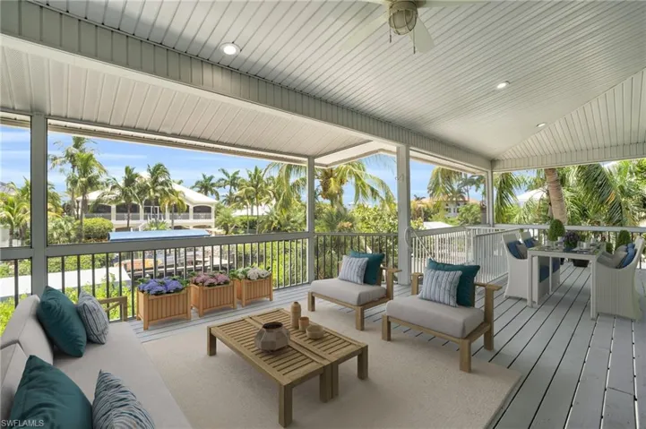 *Virtually Staged* Wooden deck featuring an outdoor living space and ceiling fan