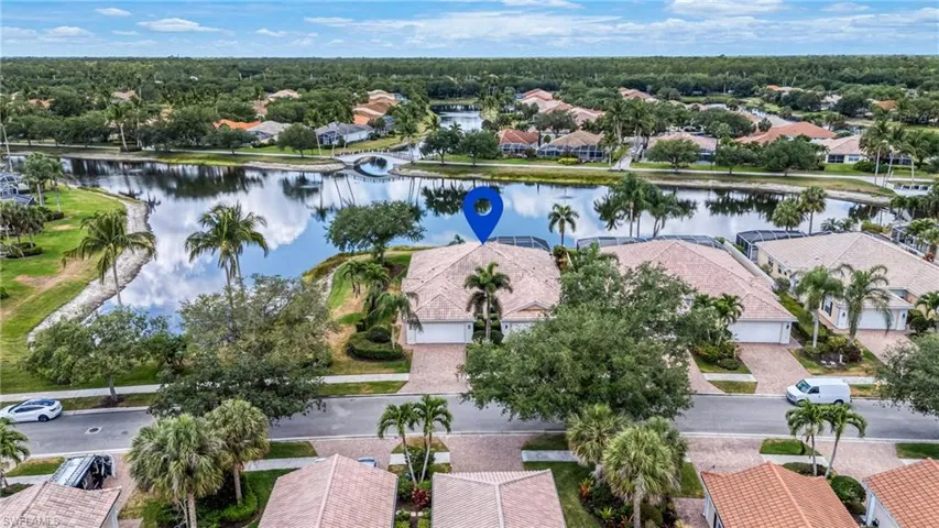 Aerial view of residential area featuring a large body of water