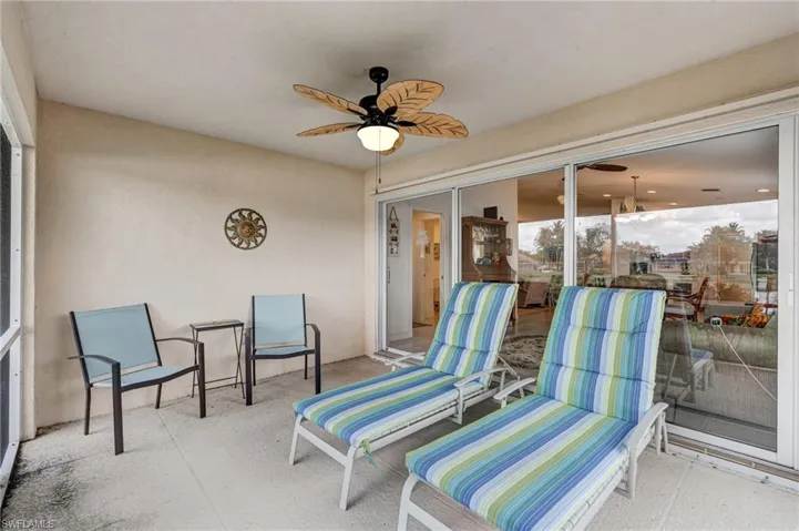 Sunroom / solarium featuring ceiling fan