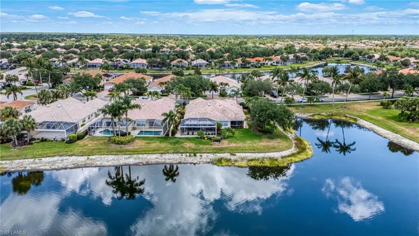 Aerial perspective of suburban area with a nearby body of water