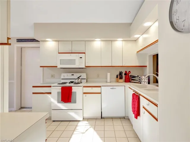 Kitchen with plenty of cabinet space and tiled floor