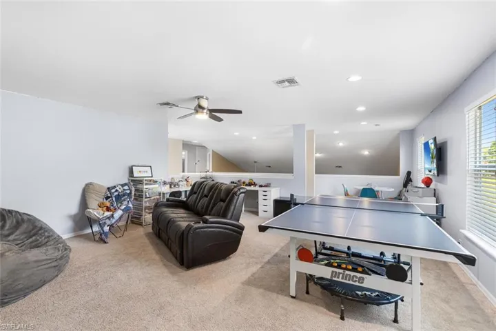 Playroom with carpet flooring, ceiling fan, and recessed lighting
