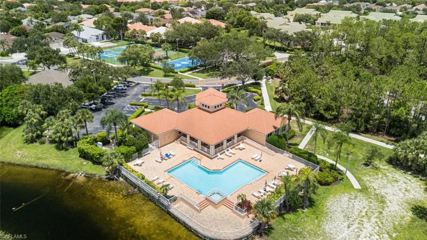 Aerial view of residential area featuring a pool area