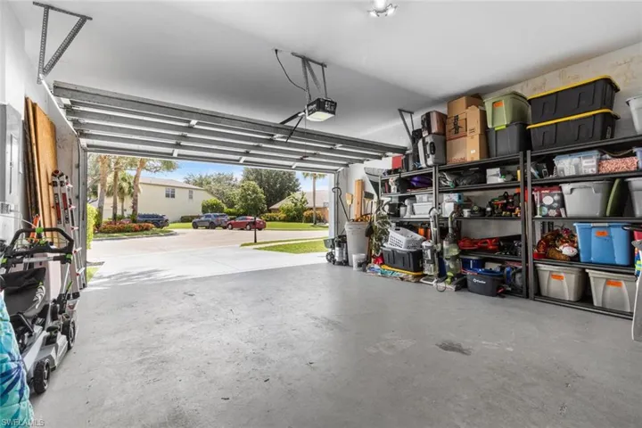 Garage featuring a garage door opener