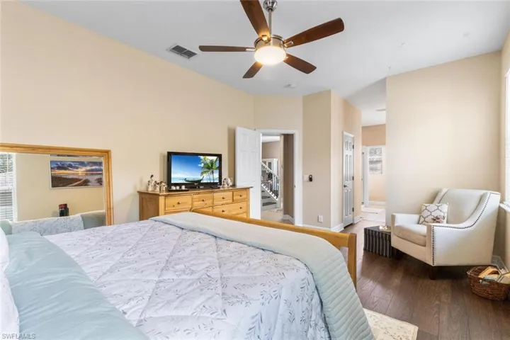 Bedroom featuring wood finished floors and a ceiling fan