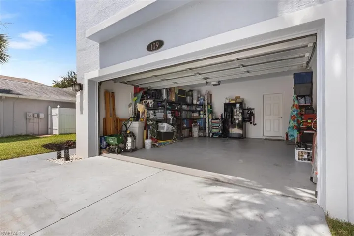 Garage featuring driveway
