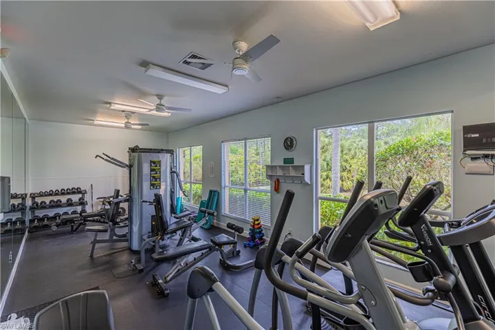 Gym featuring ceiling fan
