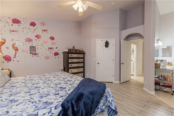 Bedroom featuring light hardwood / wood-style flooring and ceiling fan