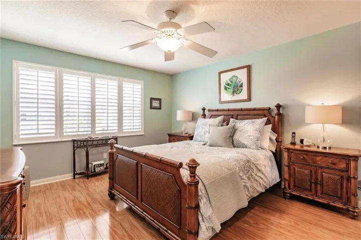 Large Master bedroom has pool and lake views.