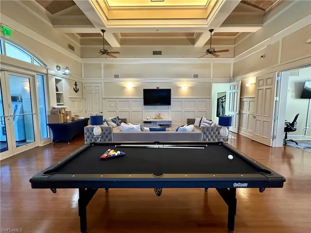 Rec room featuring coffered ceiling, a high ceiling, beam ceiling, and billiards