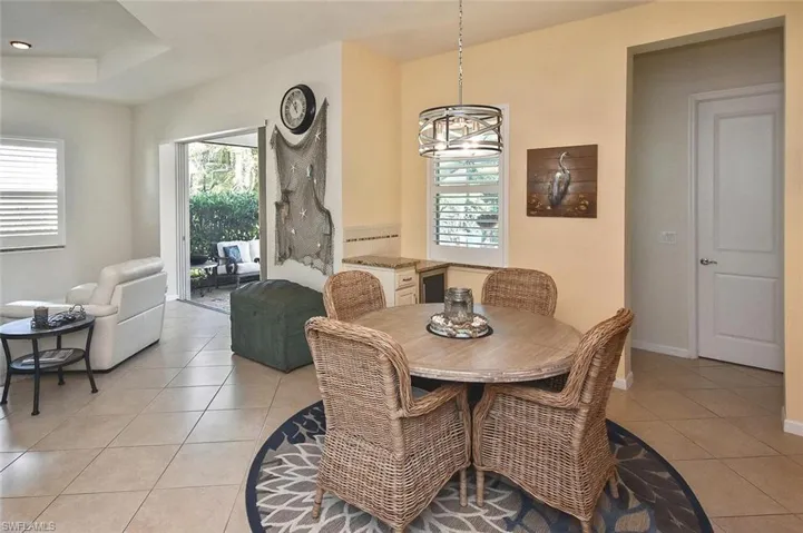 Dining Area has a small built in serving area with storage and a wine chiller