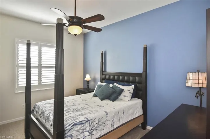 Second Guest Bedroom with large window with Plantation Shutter.