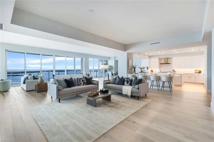 Renaissance White Oak Plank Flooring throughout with Walls of Sliding Glass Doors