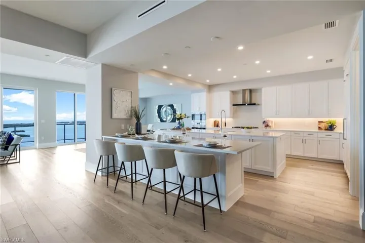 Beautiful Irpinia Raised Panel Cabinetry & Double Islands with Quartz countertops