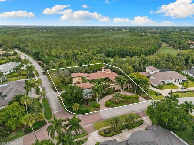 Mediterranean-style architecture with a terracotta tile roof and light-colored stucco exterior