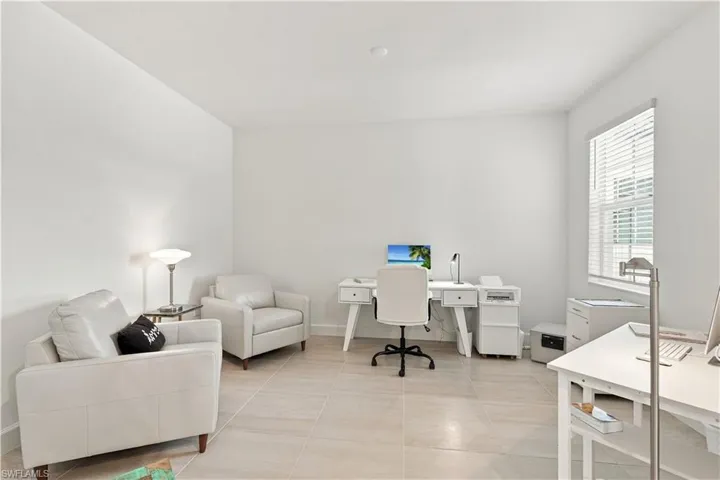 Recessed lighting, tile flooring, window with blinds, and white painted walls