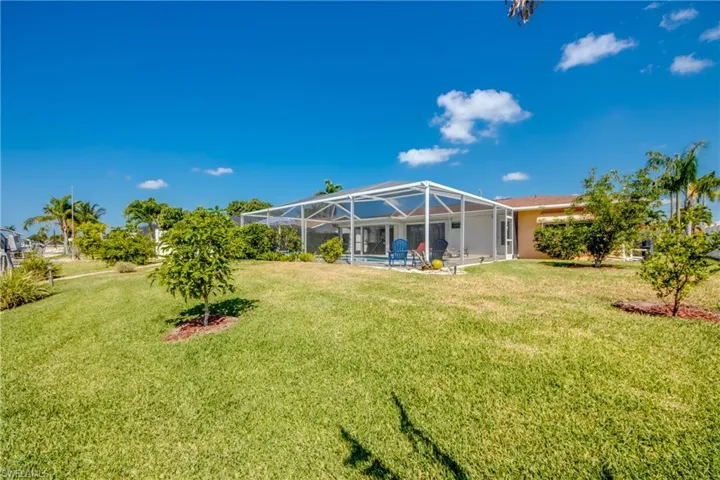 View of yard with a lanai