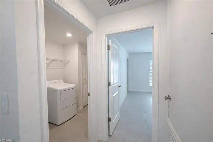 Laundry area featuring washer / dryer and baseboards