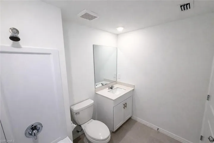 Bathroom with vanity and toilet