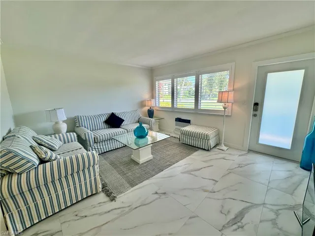 Tiled living room with crown molding