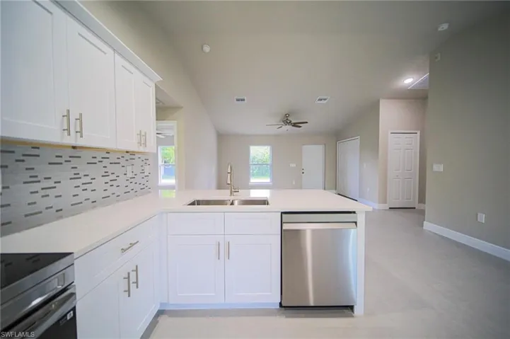This Amazing Kitchen Features Quartz Countertops, Glass Tile Backsplash, Stainless Steel Appliances, White Real Wood Soft Closing Cabinets And Drawers, A Peninsula That Seats 3 People, Glass Back Door For Plenty Of Natural Lighting, And A Ceiling To Floor Pantry!