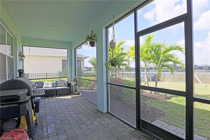 Sunroom with healthy amount of natural light and outdoor furniture