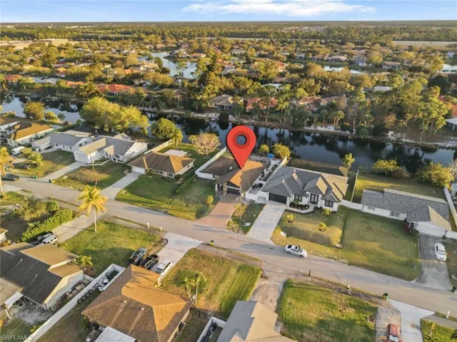 Aerial perspective of suburban area with a large body of water