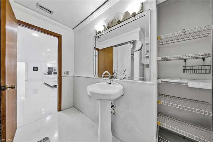Bathroom featuring crown molding