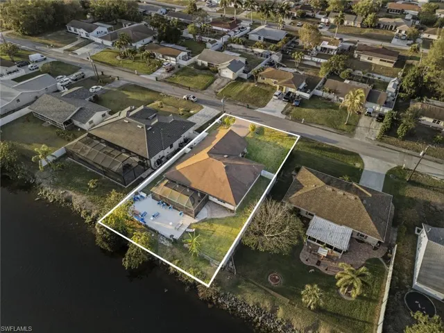 Aerial perspective of suburban area with property boundaries highlighted