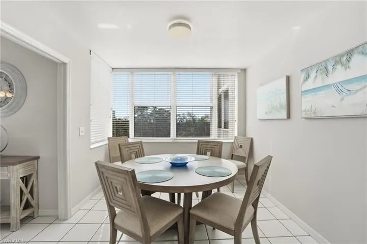 Dining room with light tile patterned floors