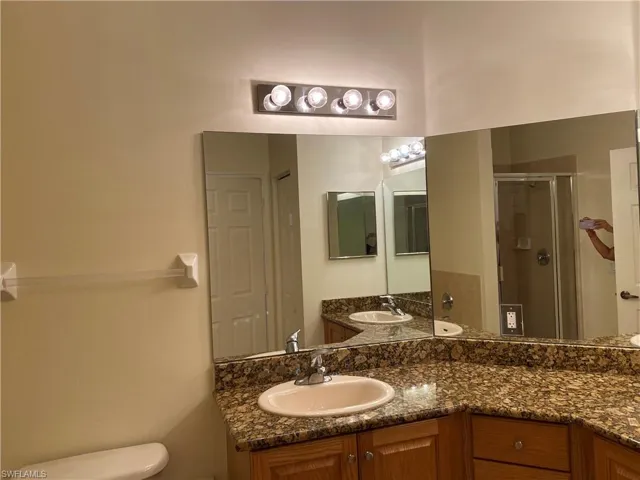 Bathroom with vanity and a shower stall