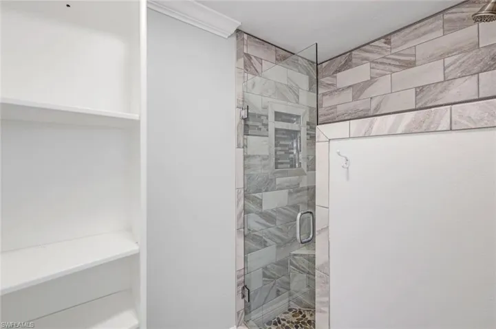 Full bath with a shower stall