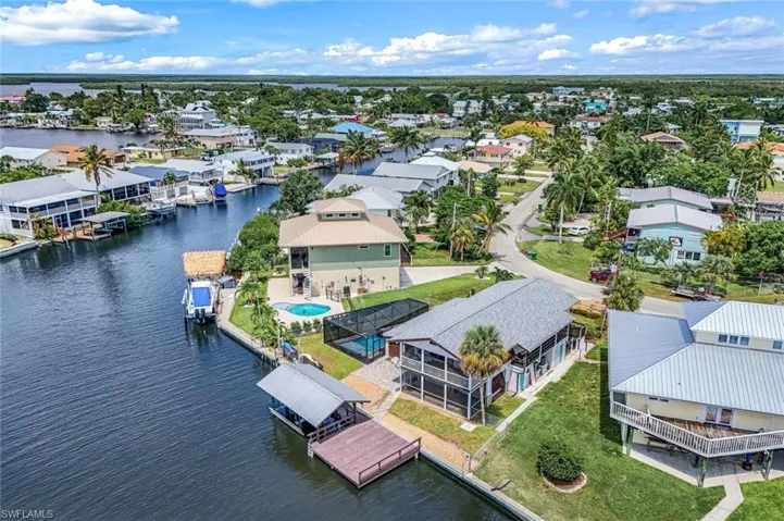 Aerial view of residential area with a large body of water
